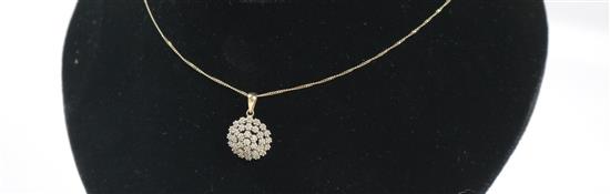 A 9ct gold and diamond set cluster pendant on a 9ct gold chain, pendant 15mm.